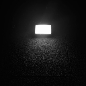 Rectangular light source against dark background